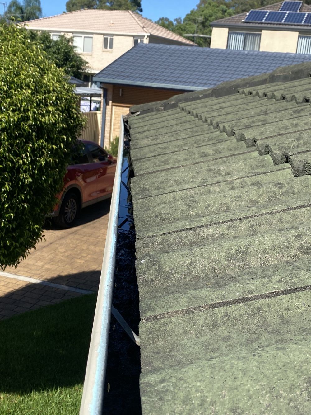 Gutter holding water from poor fall or a blocked outlet, found during a building and pest inspection in Horningsea Park