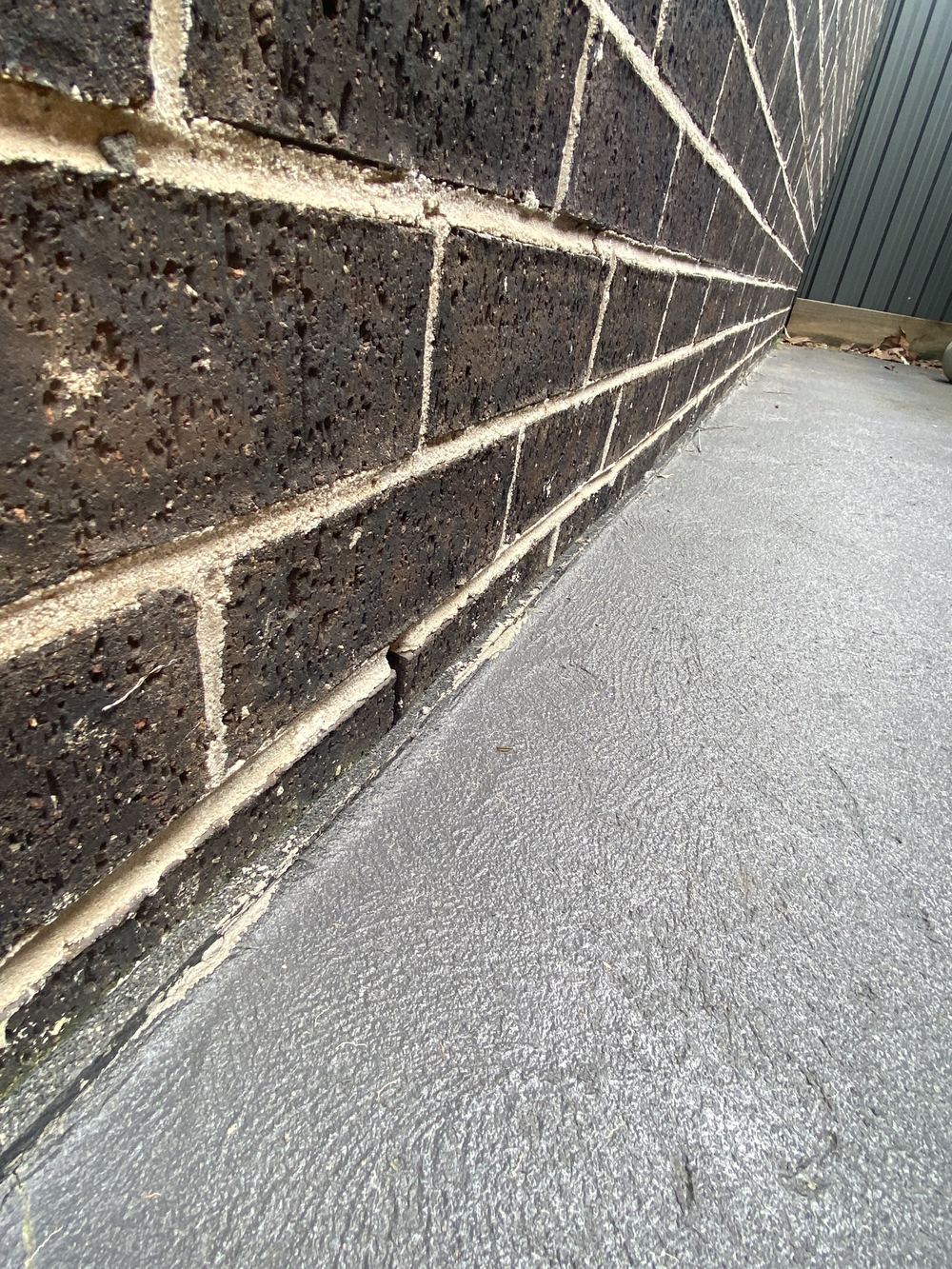 Weep holes buried by the garden