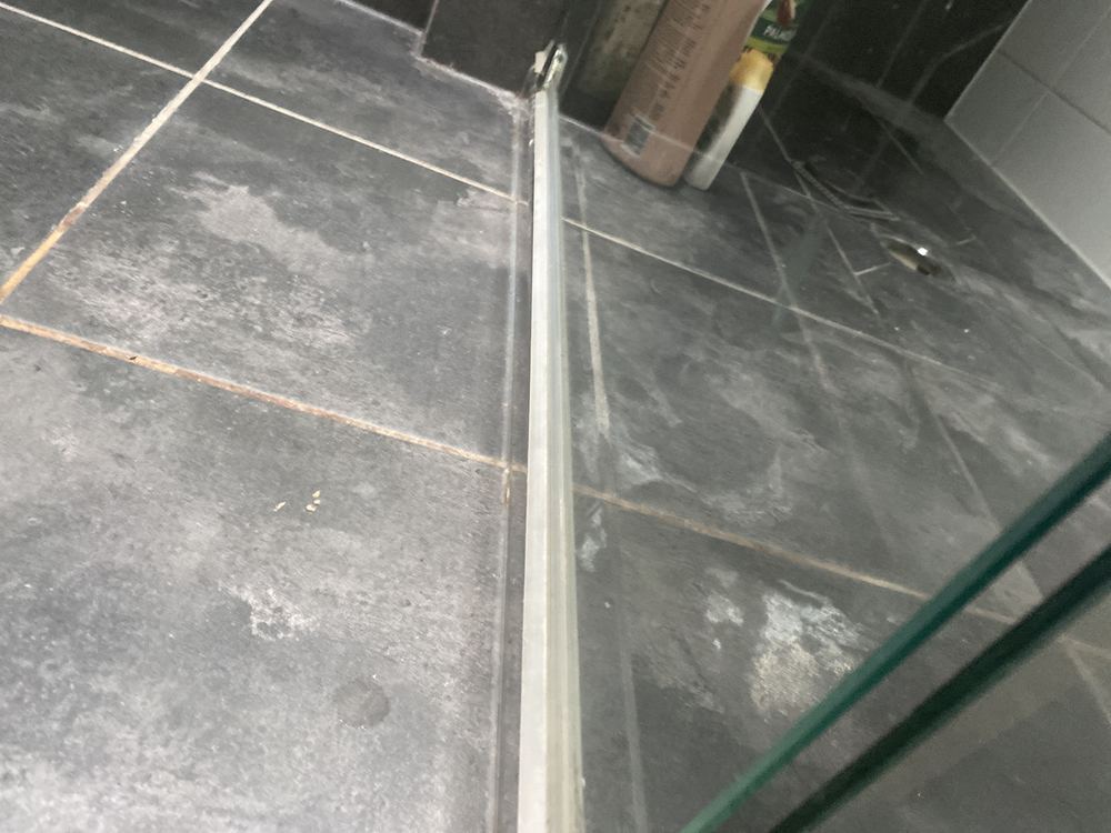 A ceiling stain under an upstairs shower