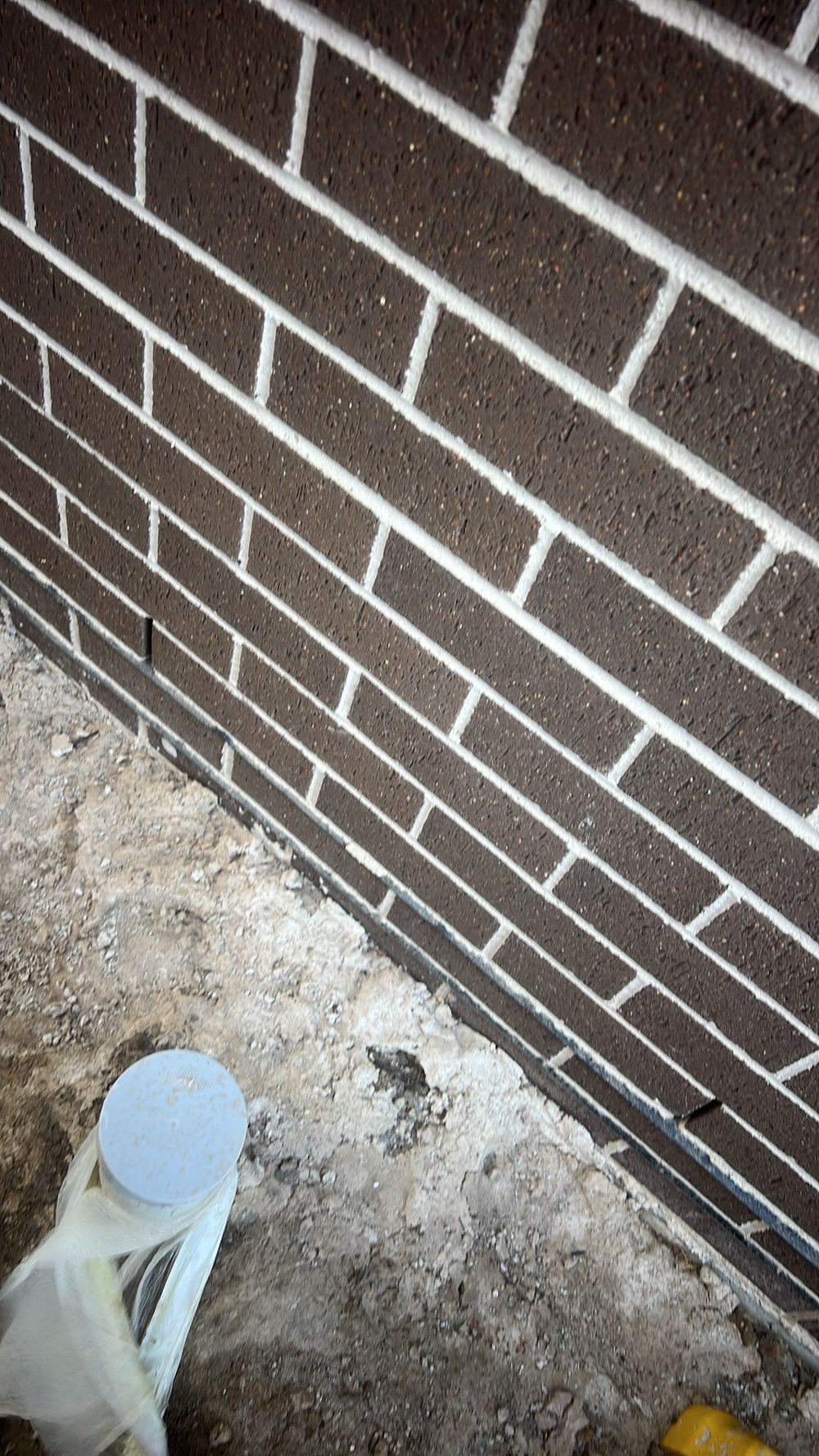 Cladding needing 150mm clearance above the soil, found during a handover inspection in Cobbitty