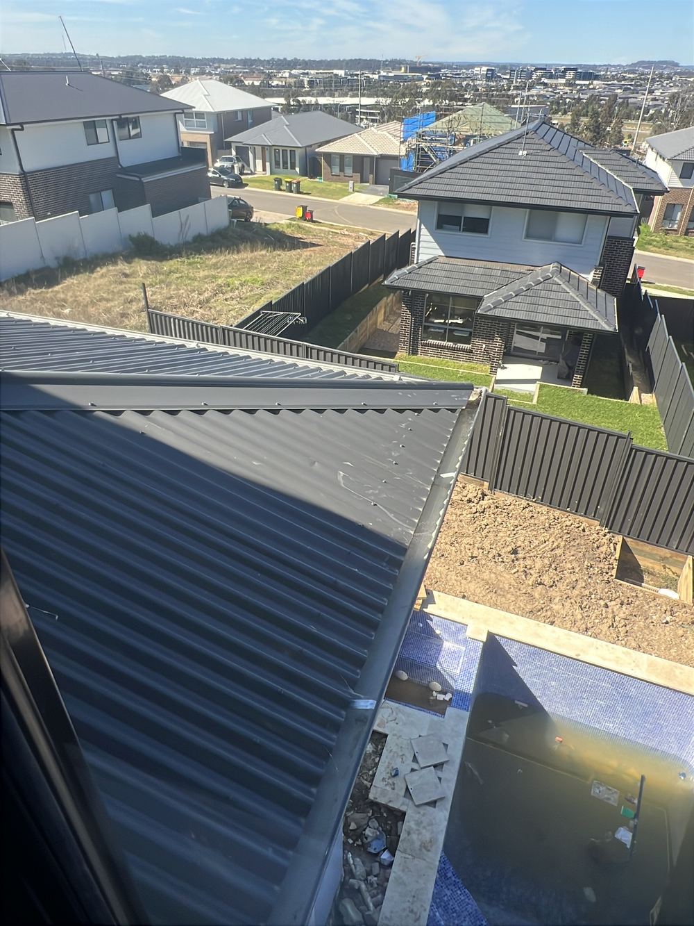 Dented metal roof, found during a handover inspection in Cobbitty